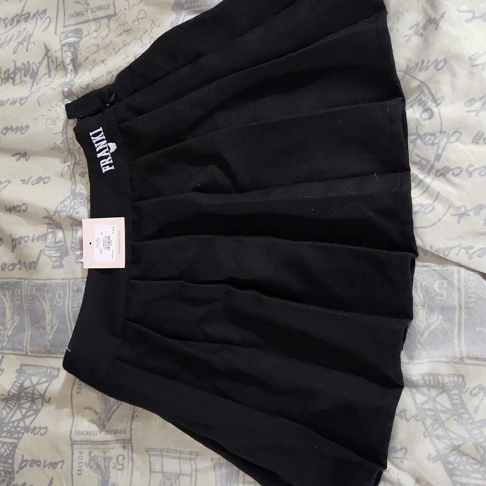 Girl black pleated mini skirt